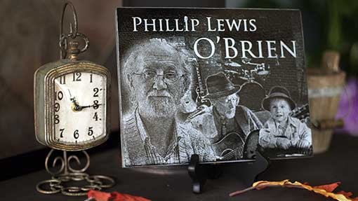 Close-up of a granite featuring the name PHILLIP LEWIS O'BRIEN