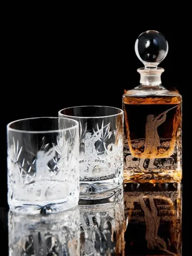 Marking and Engraving for Glass Materials Engraved glassware set, featuring two glasses and a whiskey decanter with intricate designs